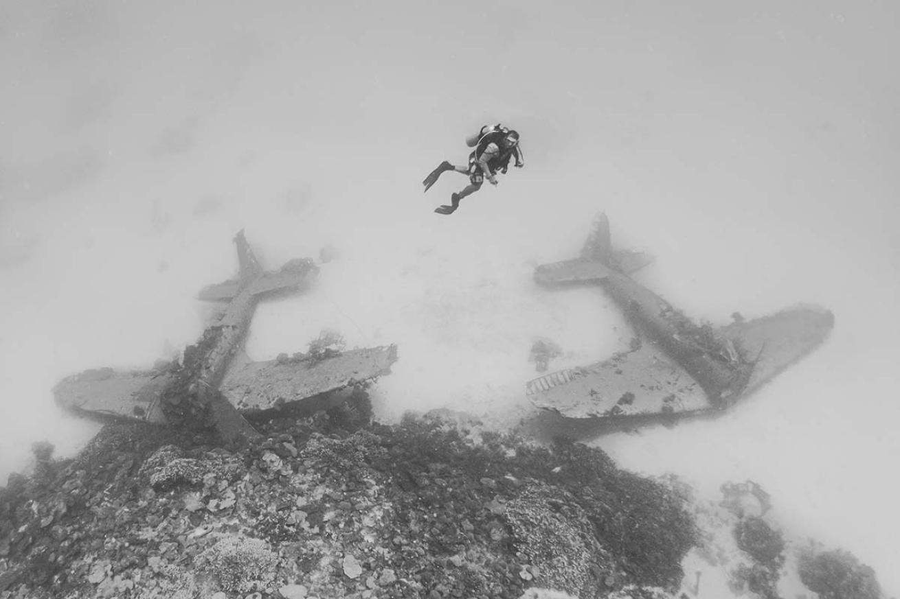 Diver with sunken planes